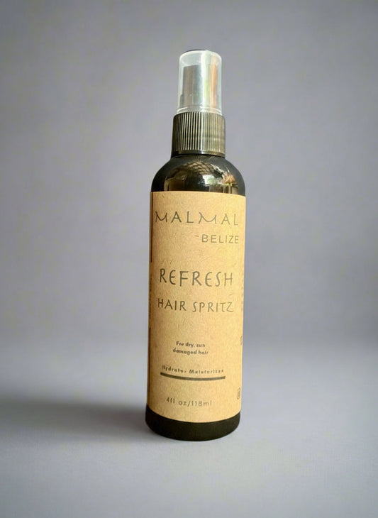 Hair spritz bottle labeled 'Refresh' by MALMAI on a gray background